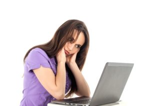 Girl sits a computer